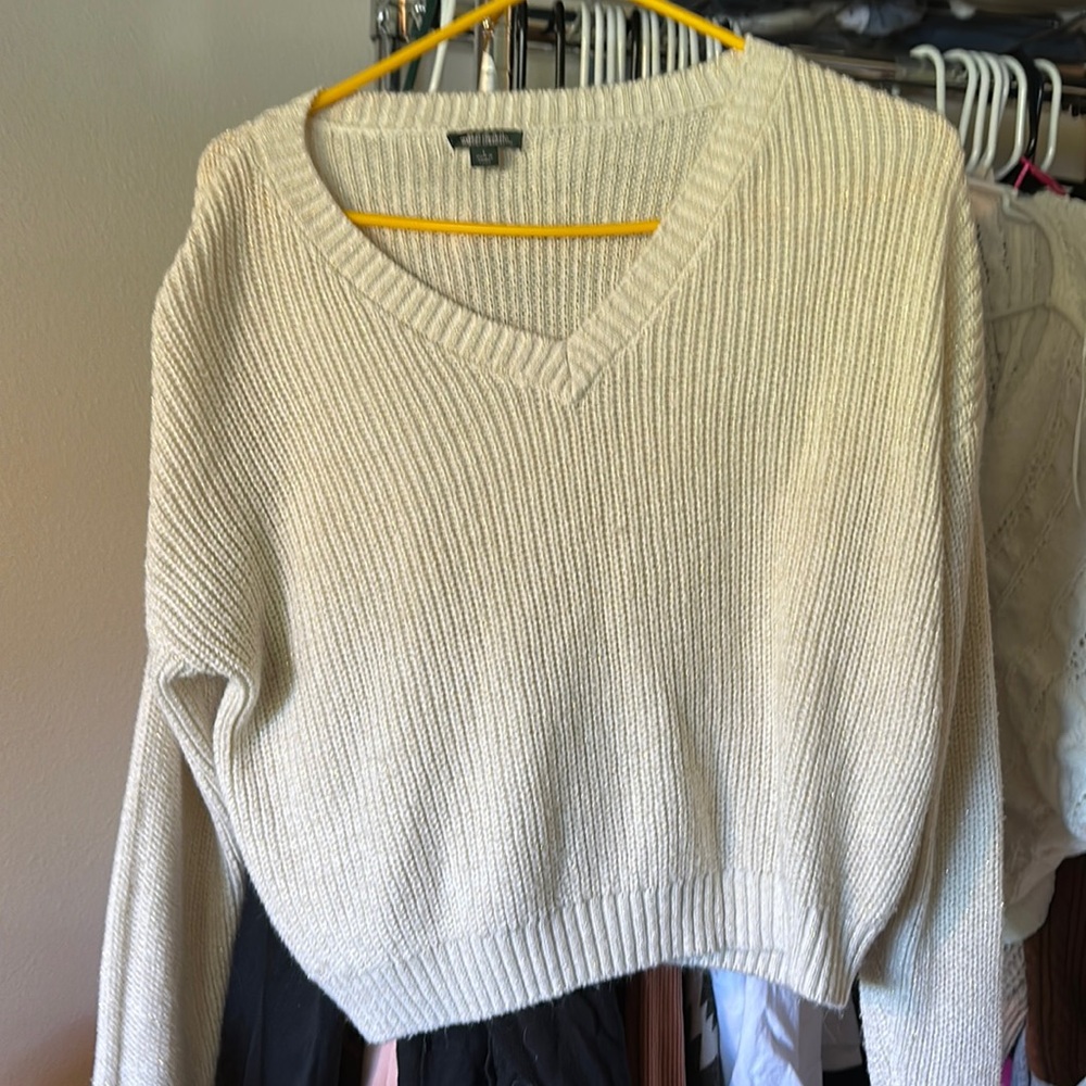 White and gold sweater